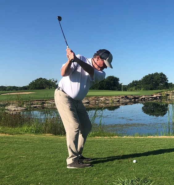 Man playing golf at The Hideout