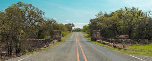 Road leading to Lake Brownwood State Park, a scenic stop for day trips from Austin. Photo by Alyh M.