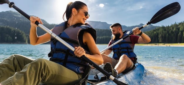 couple kayaking - shutterstock PintoArt